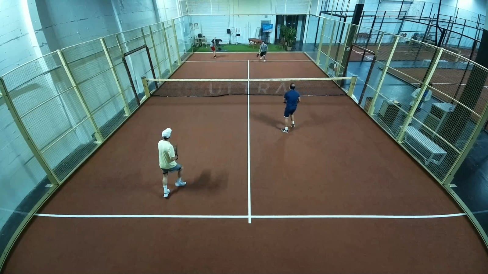 What a Clutch camera sees from the back fence of a padel court