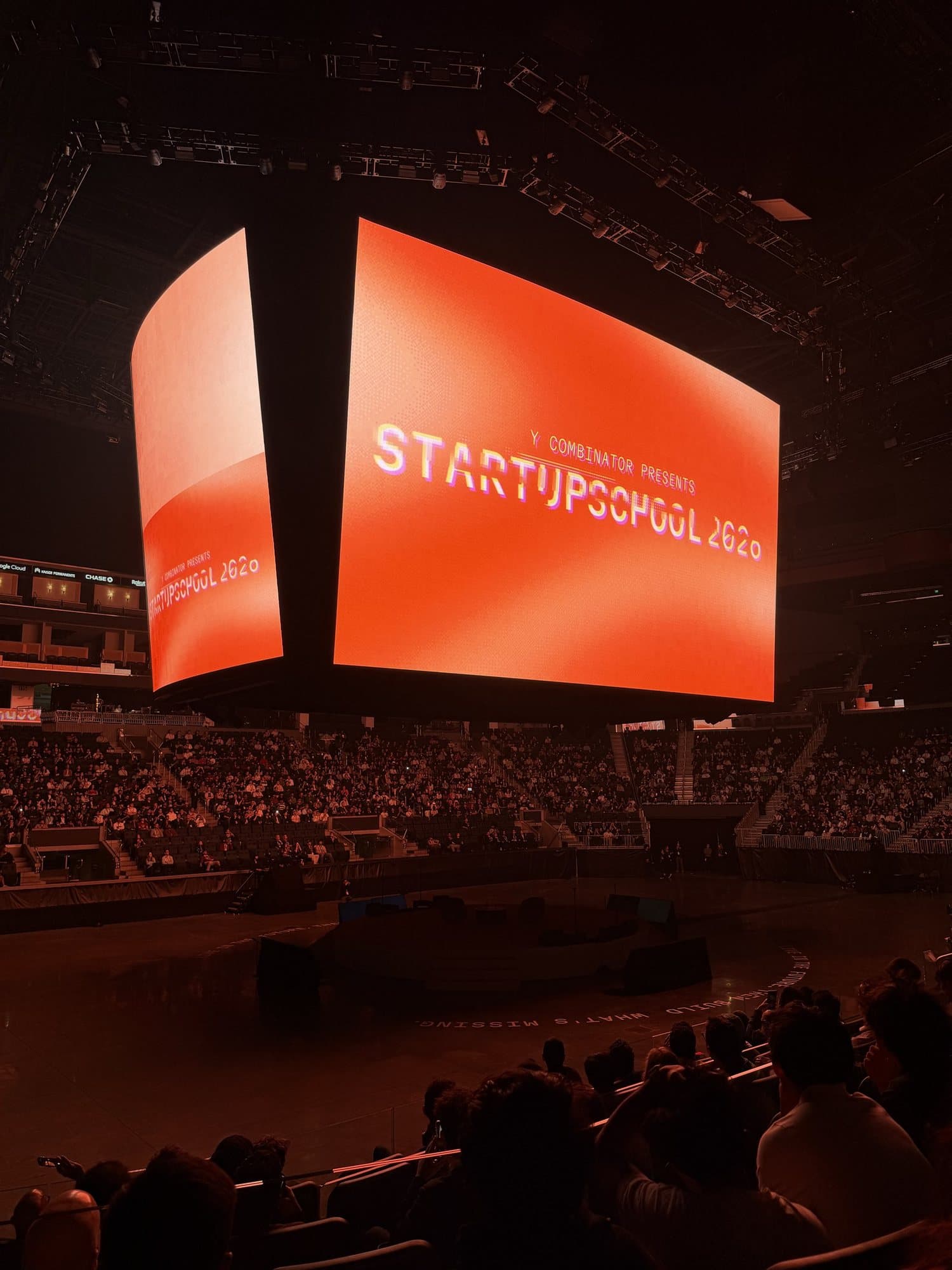 Startup School 2026 on the Chase Center's screens before a talk
